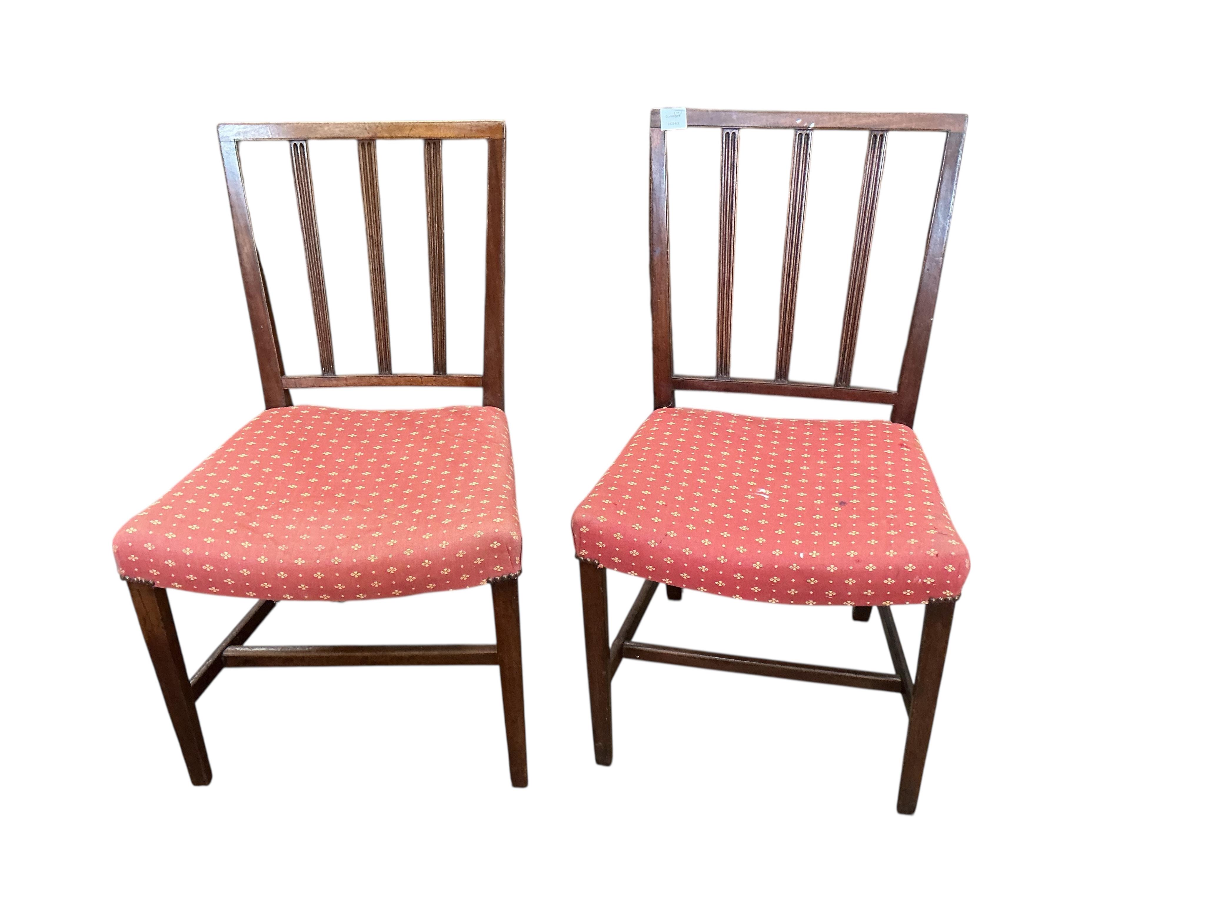 A set of four George III mahogany dining chairs